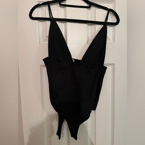 Free People body suit with tag on